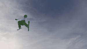 continuous improvement freestyle skiier in the sky with clouds behind them